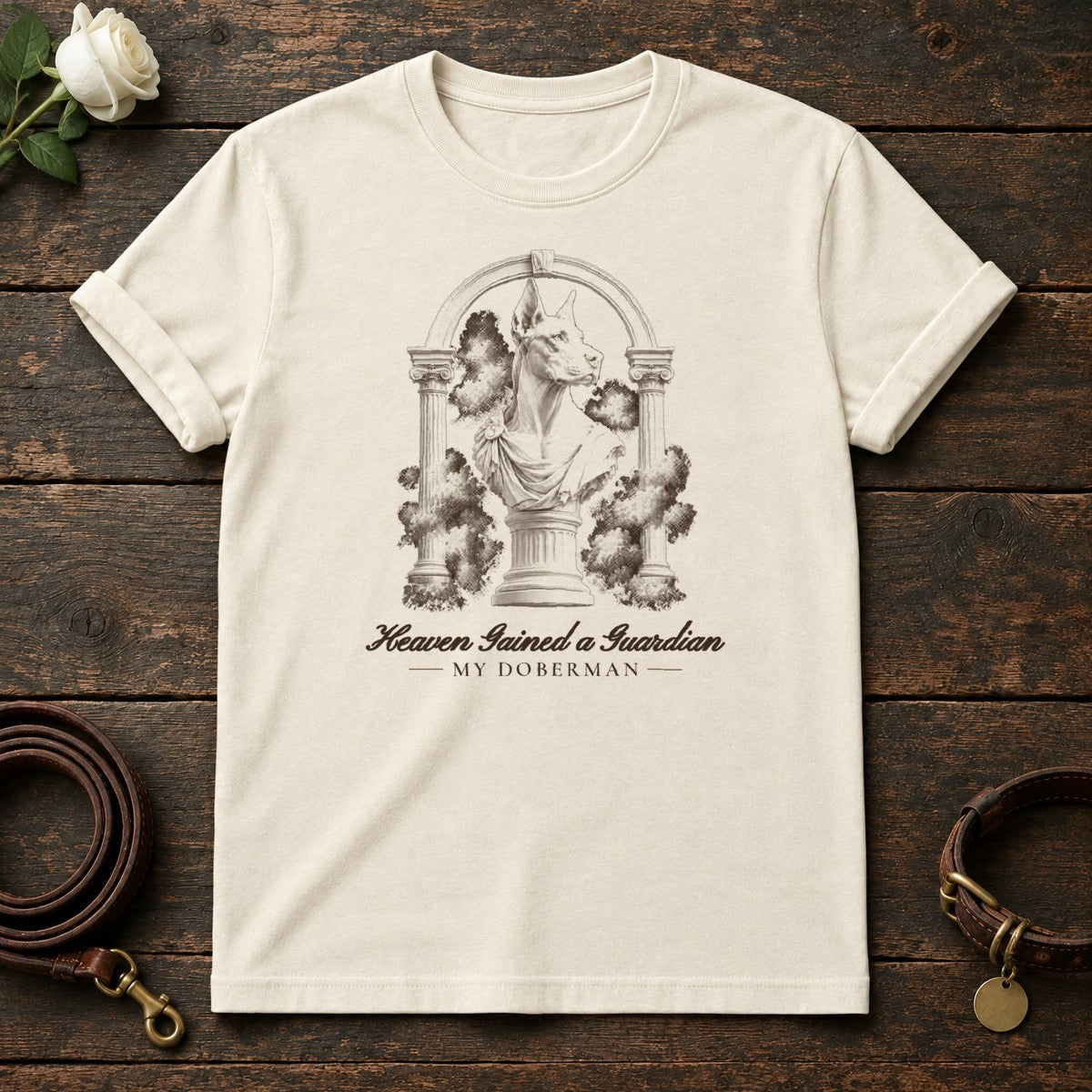 Heaven Gained a Guardian – Roman Arch Doberman Memorial Tee in Natural