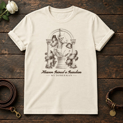 Heaven Gained a Guardian – Roman Arch Doberman Memorial Tee in Natural