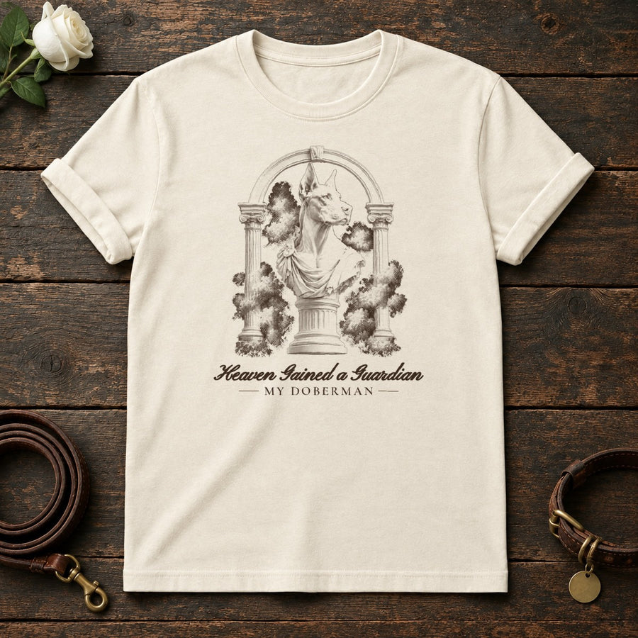 Heaven Gained a Guardian – Roman Arch Doberman Memorial Tee in Natural